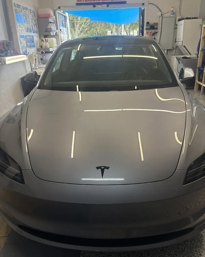 Silver Tesla with ceramic coating reflections